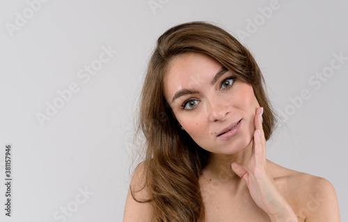 Portrait of a sensual young woman. Close up portrait over white background