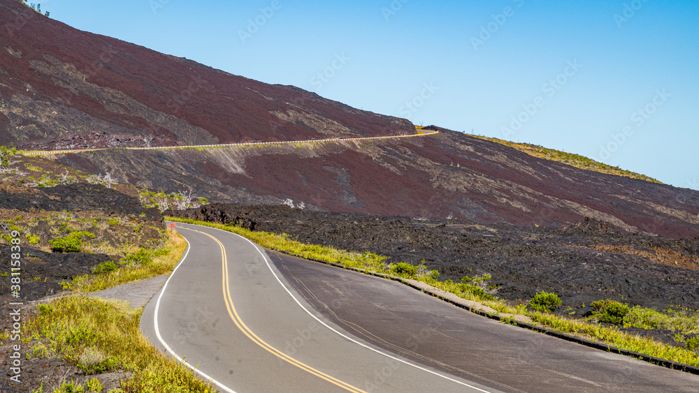 Highway on a volcanic landscape. Amazing scenery. Hawaii.