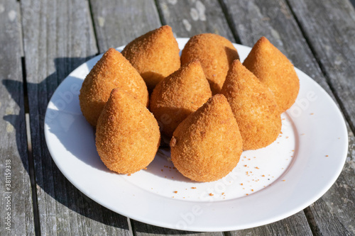 Coxinhas, brazilian snacks party food, nicely served in a plate photo