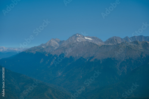 blurred abstract natural background with Mountains in a morning blue mist © dvulikaia