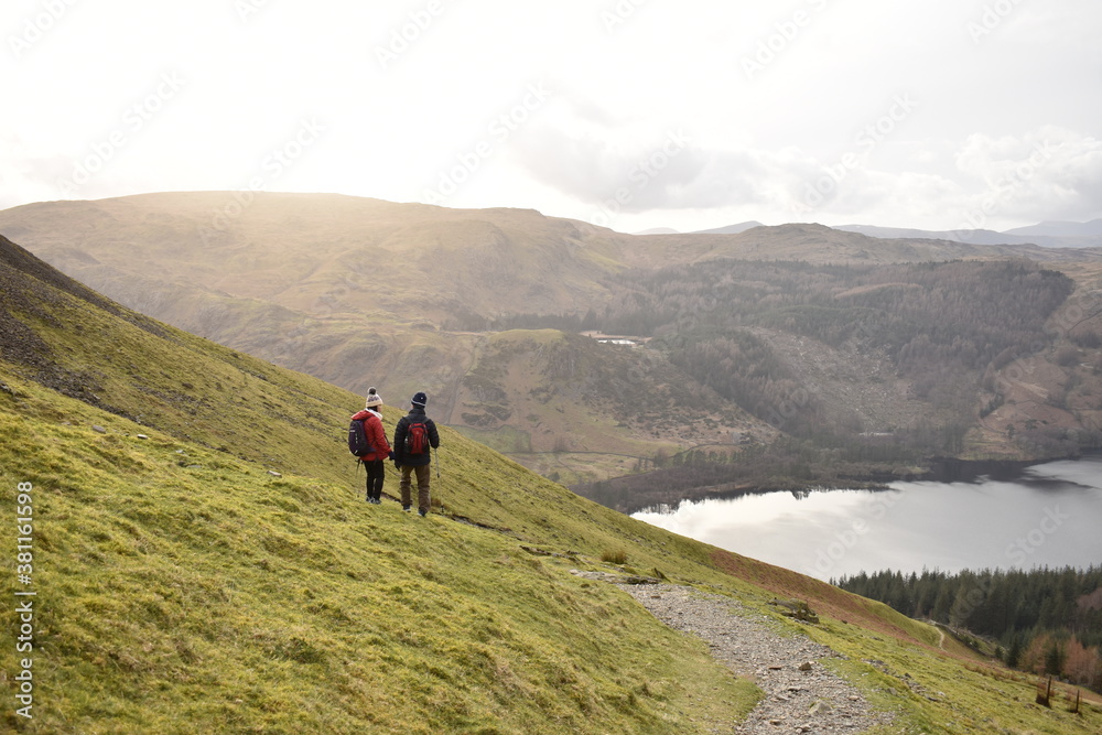 Obraz premium A couple trekking together Helvellyn Lake District