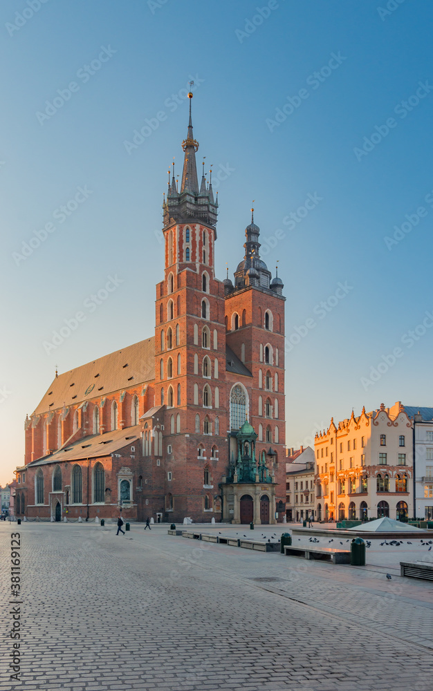 Fototapeta premium Krakow, Poland, St Mary's church on the Main Square in the morning sunlight