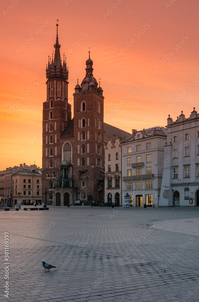 Main square with St Mary's church, colorful sunrise, Krakow, Poland