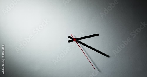 The hands of a wall clock moving fast. Timelapse.