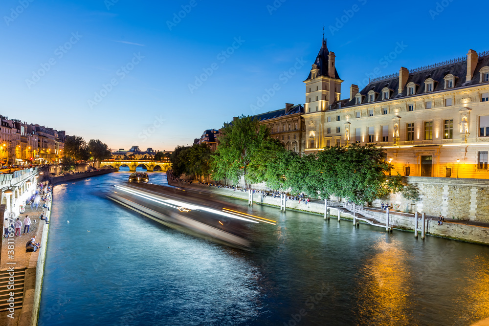 on the seine river in paris at night