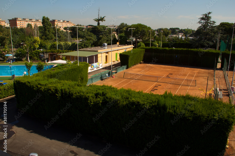 view of the tennis court  in the morning