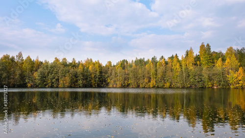 Autumn landscape of Karelian forest, lake and sky