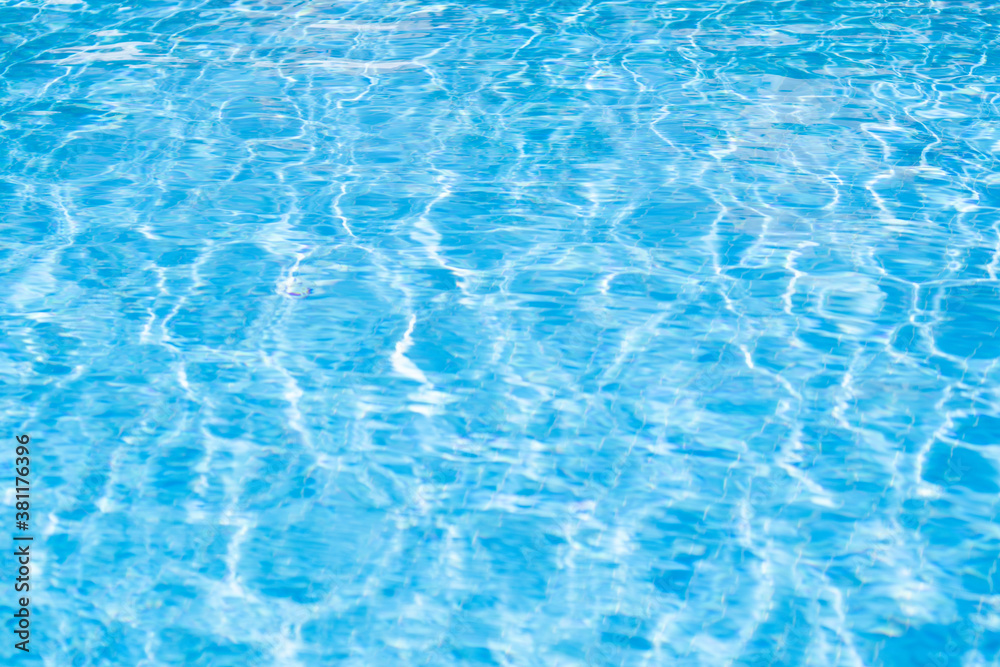 Texture of water in pool. Closeup of rough water surface texture with splashes. Waving water texture backdrop Texture of water in pool. Closeup of rough water surface texture with splashes. Waving water texture backdrop
