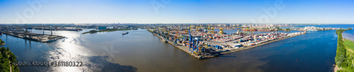 Aerial view of cargo ship, cargo container in warehouse harbor in the Morskie Vorota district in St. Petersburg