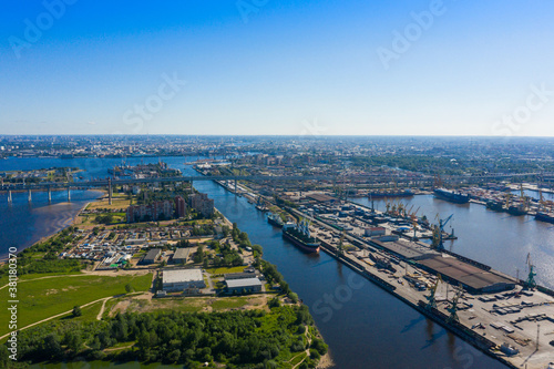 Aerial view of cargo ship, cargo container in warehouse harbor in the Morskie Vorota district in St. Petersburg