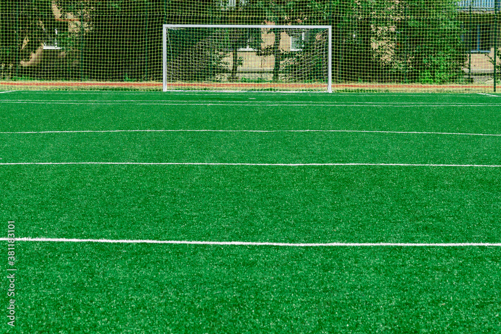 Obraz premium soccer gates. Football goal at the stadium. Football field with artificial lawn. Concept other party of soccer. At stadium.