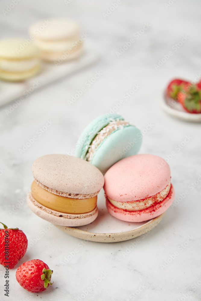 French cake macarons on a marble background
