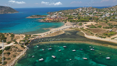 Aerial drone photo of famous islet, beach and bay of Agios Nikolaos in Anavysos area with crystal clear emerald sea, Athens riviera, Attica, Greece photo