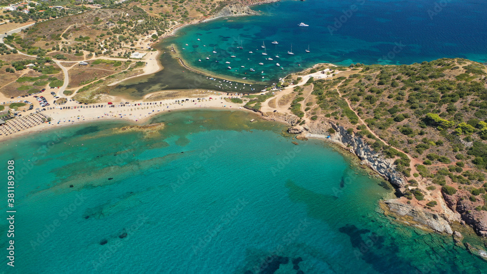 Aerial drone photo of famous islet, beach and bay of Agios Nikolaos in Anavysos area with crystal clear emerald sea, Athens riviera, Attica, Greece Aerial drone photo of famous islet, beach and bay of Agios Nikolaos in Anavysos area with crystal clear emerald sea, Athens riviera, Attica, Greece
