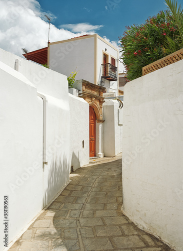 Fototapeta Naklejka Na Ścianę i Meble -  beautiful yellow flowers in the old streets of Rhodes, Greece, Lindos

