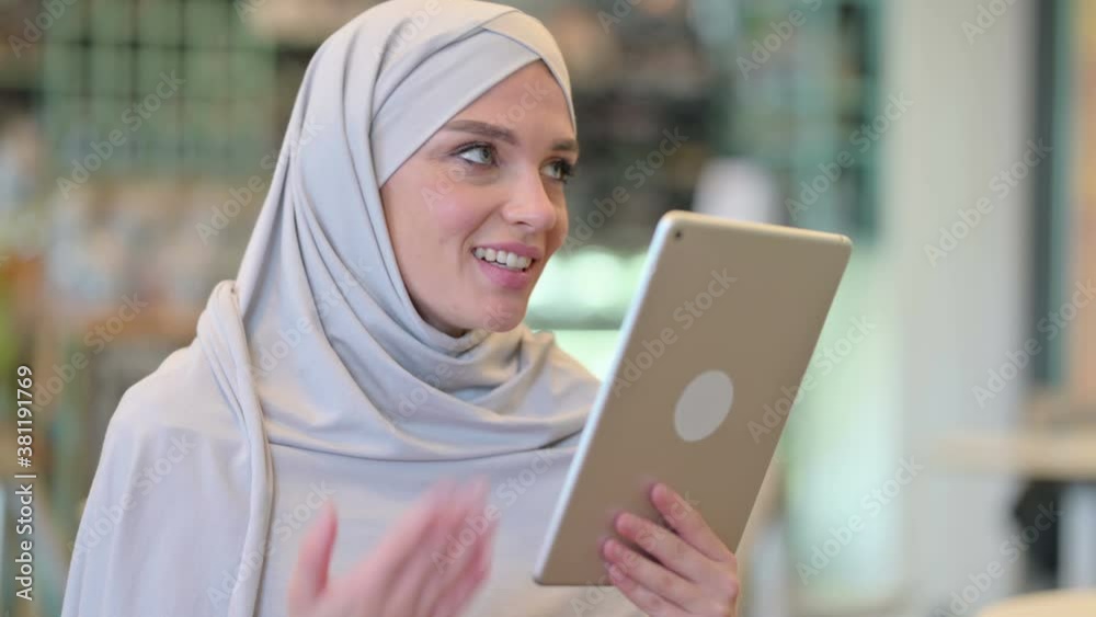 Portrait of Young Arab Woman doing Video Call on Tablet Portrait of Young Arab Woman doing Video Call on Tablet