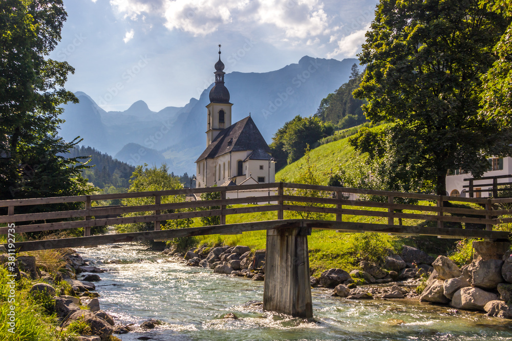 sunny day by the river next to the church in Ramsau, Germany