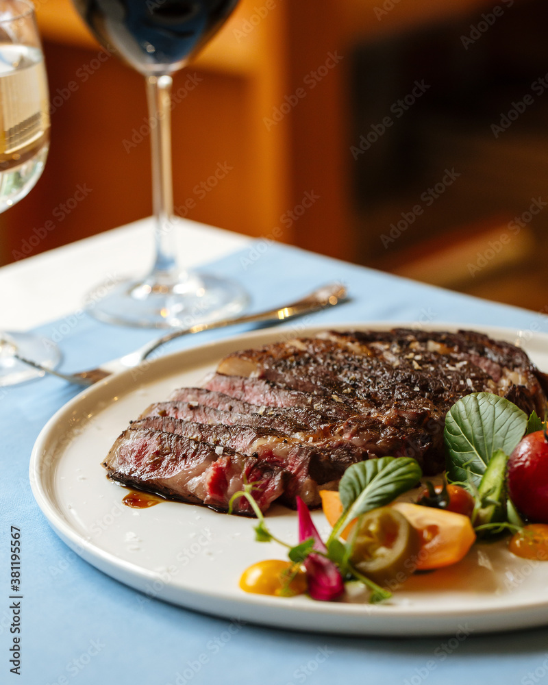 Ribeye beef steak with fresh vegetable salad Ribeye beef steak with fresh vegetable salad