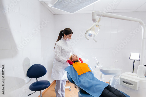 The dentist conducts an examination and consultation of the patient. Dentistry