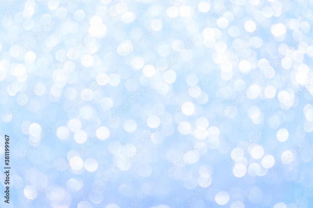 Beautiful blue abstract background with bokeh defocused lights.Winter Christmas and New Year background.