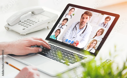 Man having video chat with doctors