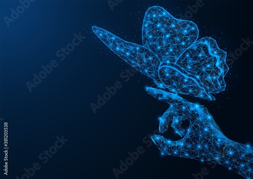 Hand of a man with a butterfly on his finger. Polygonal design of concatenated lines and points. Blue background.