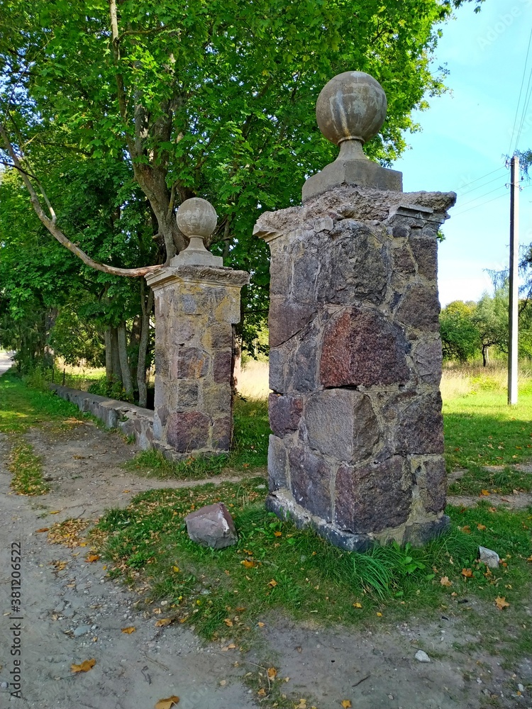 stone gate of old abandoned Jewish homestead Leiba Strugach in Ashmyany, Grodno region, Belarus, 2020. stone gate of old abandoned Jewish homestead Leiba Strugach in Ashmyany, Grodno region, Belarus, 2020.
