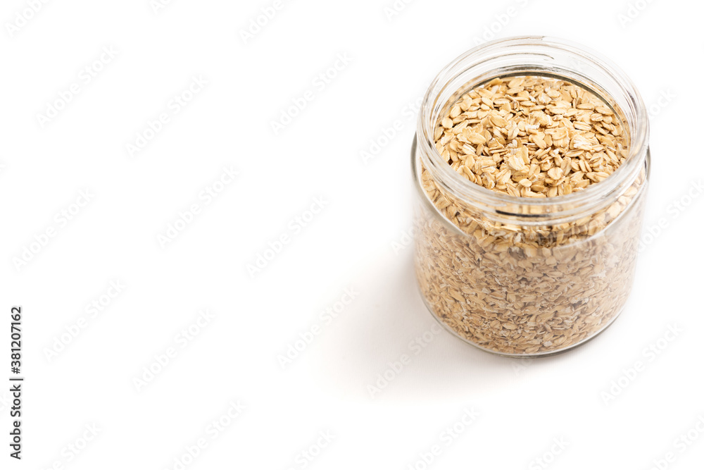 Jar of oat flakes isolated on white background Jar of oat flakes isolated on white background