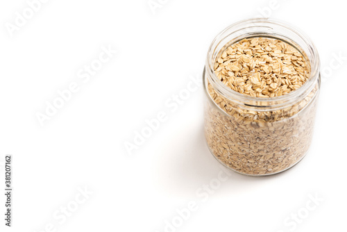 Jar of oat flakes isolated on white background