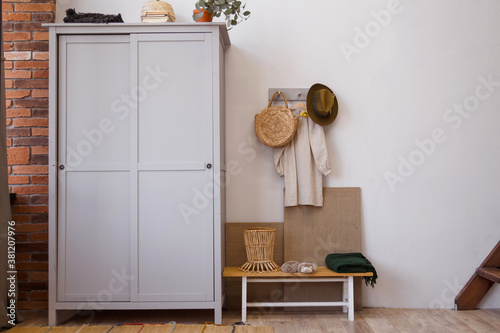 Rustic eco style interior made of natural materials. Wooden wardrobe in the room photo