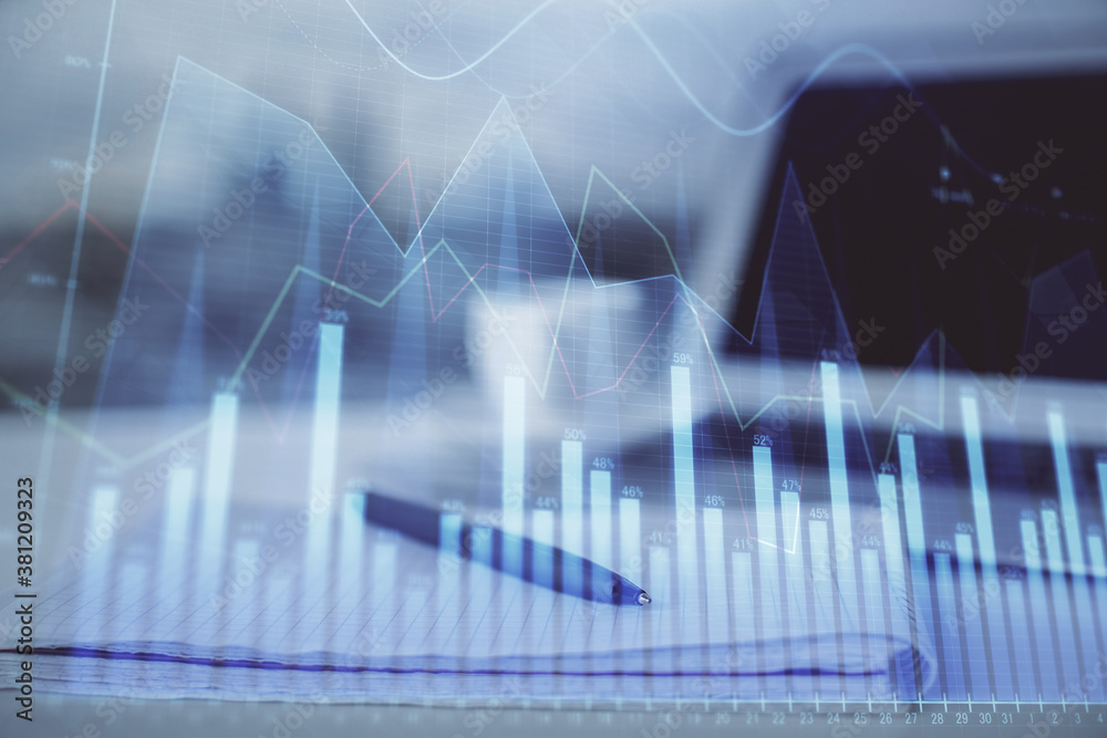 Double exposure of financial graph drawings and desk with open notebook background. Concept of forex market Double exposure of financial graph drawings and desk with open notebook background. Concept of forex market