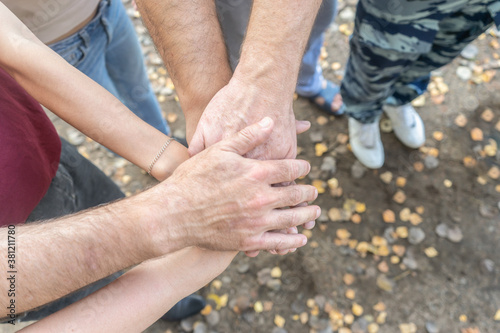 Business people fold their hands together. Teamwork, support concept.