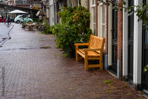 Wooden bench on the street of Leiden, Netherlands © zivko.trikic