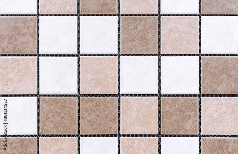 Ceramic mosaic tiles with brown, beige and white squares.