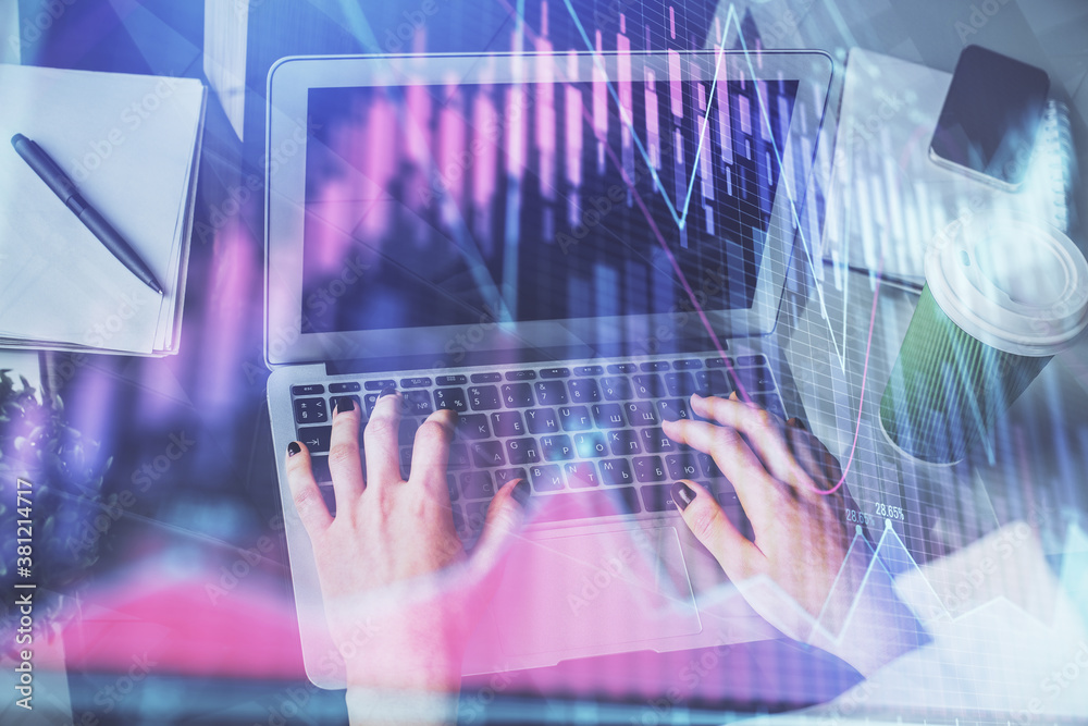 Double exposure of woman hands typing on computer and forex chart hologram drawing. Stock market invest concept.