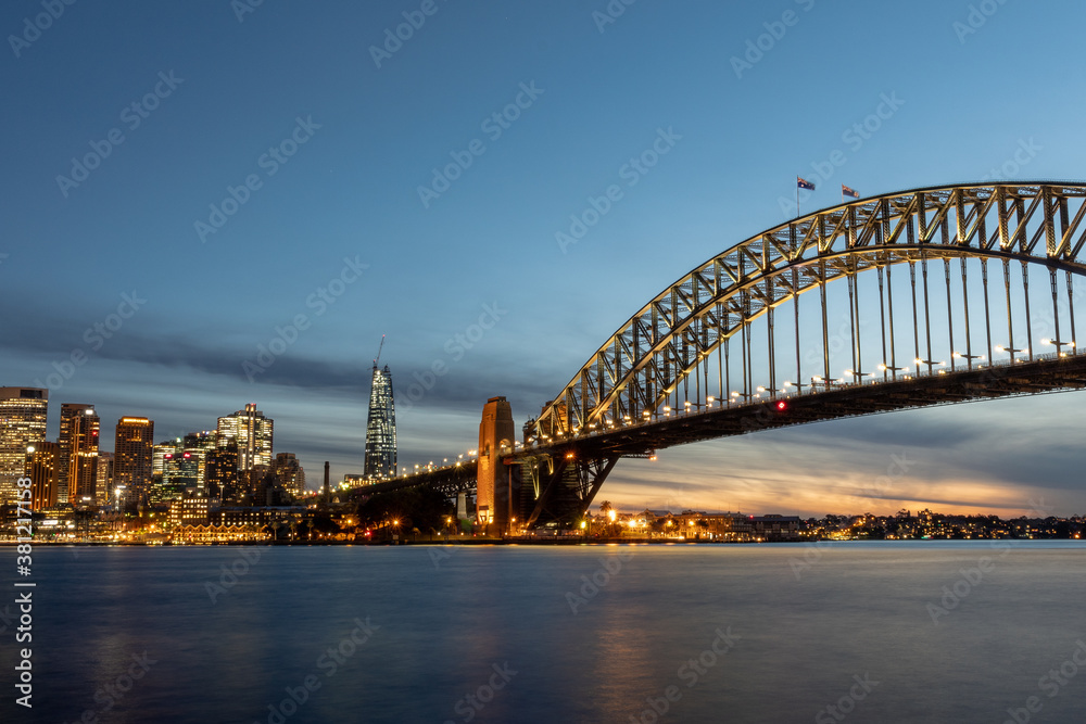 Sydney Harbour Bridge at sunset with new casino in the background