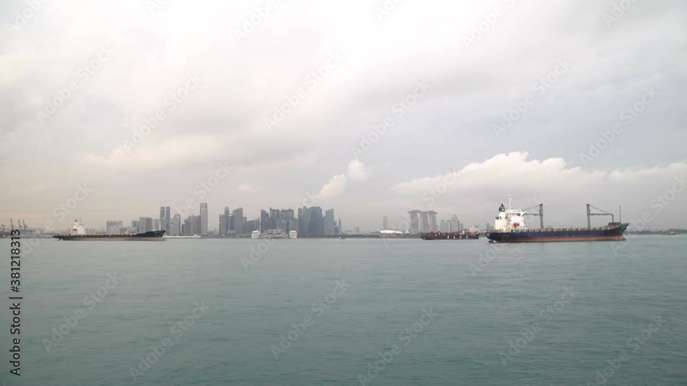 Many ships are anchored in the port of Singapore. Many ships are anchored in the port of Singapore.