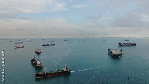 Many ships are anchored in the port of Singapore.