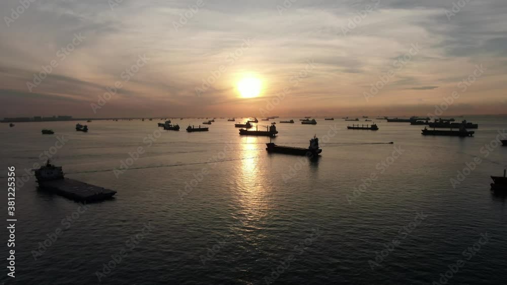 Many ships are anchored in the port of Singapore. Many ships are anchored in the port of Singapore.