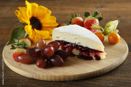 Brie cheese with red fruit jam