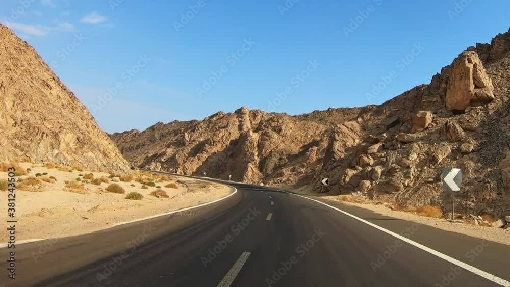Riding a road through the desert and mountains in Egypt Riding a road through the desert and mountains in Egypt