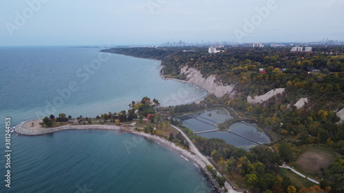 Aerial Panoramic Landscape Image of a Coastline in Toronto with beautiful park and skyline and nature view during fall with autumn colours during dawn