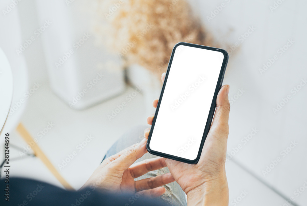 cell phone mockup blank white screen.woman hand holding texting using mobile on desk at coffee shop.background empty space for advertise.work people contact marketing business,technology cell phone mockup blank white screen.woman hand holding texting using mobile on desk at coffee shop.background empty space for advertise.work people contact marketing business,technology