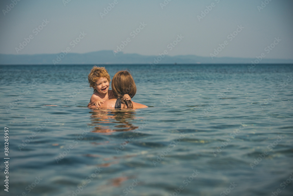 Vacation in the ocean. Mom and baby. Great family time for a young mother and son.