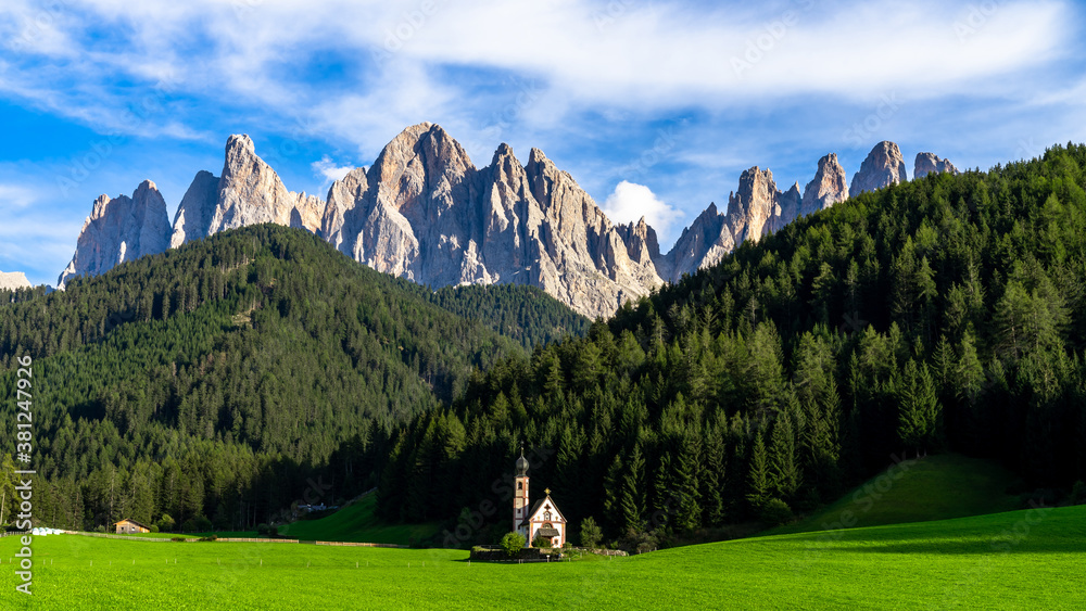 Famouse church in Santa Maddalena village, Village in the Dolomites mountain peaks in St. Magdalena or Santa Maddalena with characteristic church, South Tyrol, Italy