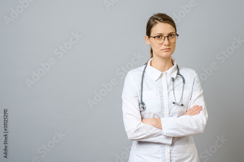 Portrait of serious doctor with stethoscope looking at camera