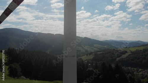 Take off in front of wind turbine photo