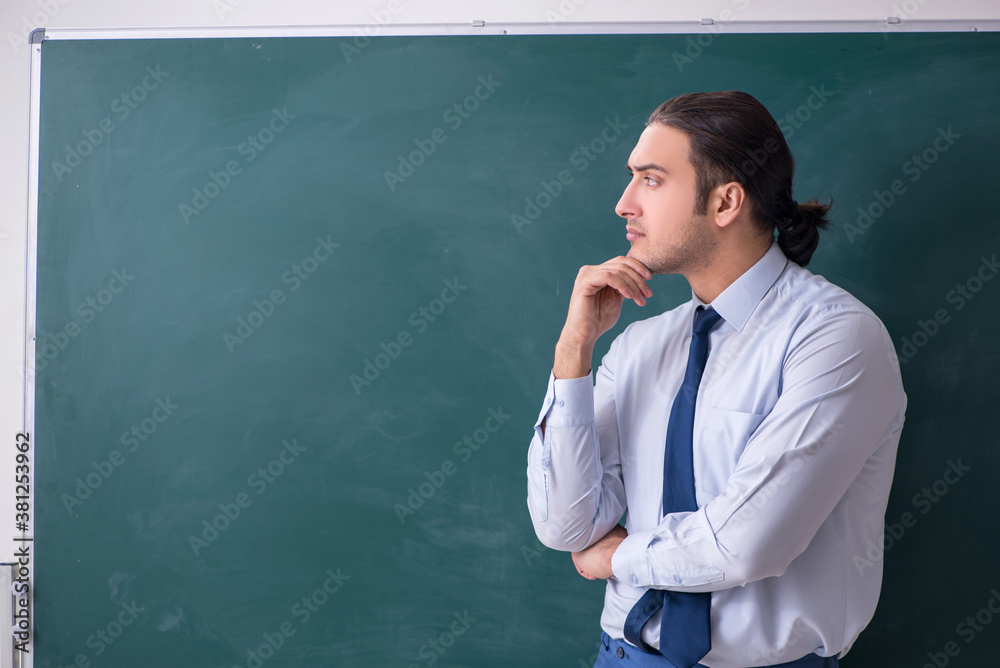 Young man employee in business presentation concept Young man employee in business presentation concept
