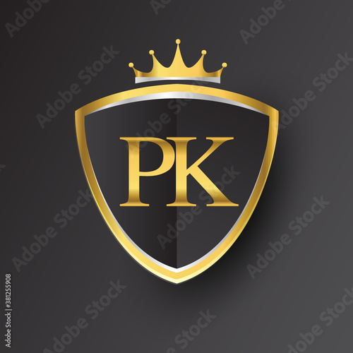 Initial logo letter PK with shield and crown Icon golden color isolated on black background, logotype design for company identity.