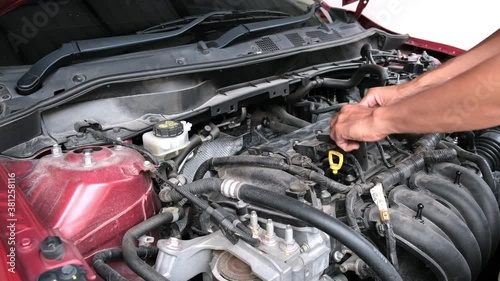 Wallpaper Mural Asian Man mechanic inspection Shine a torch car engine checking bug in engine from application smartphone.Red car for service maintenance insurance with car engine.for transport automobile automotive Torontodigital.ca